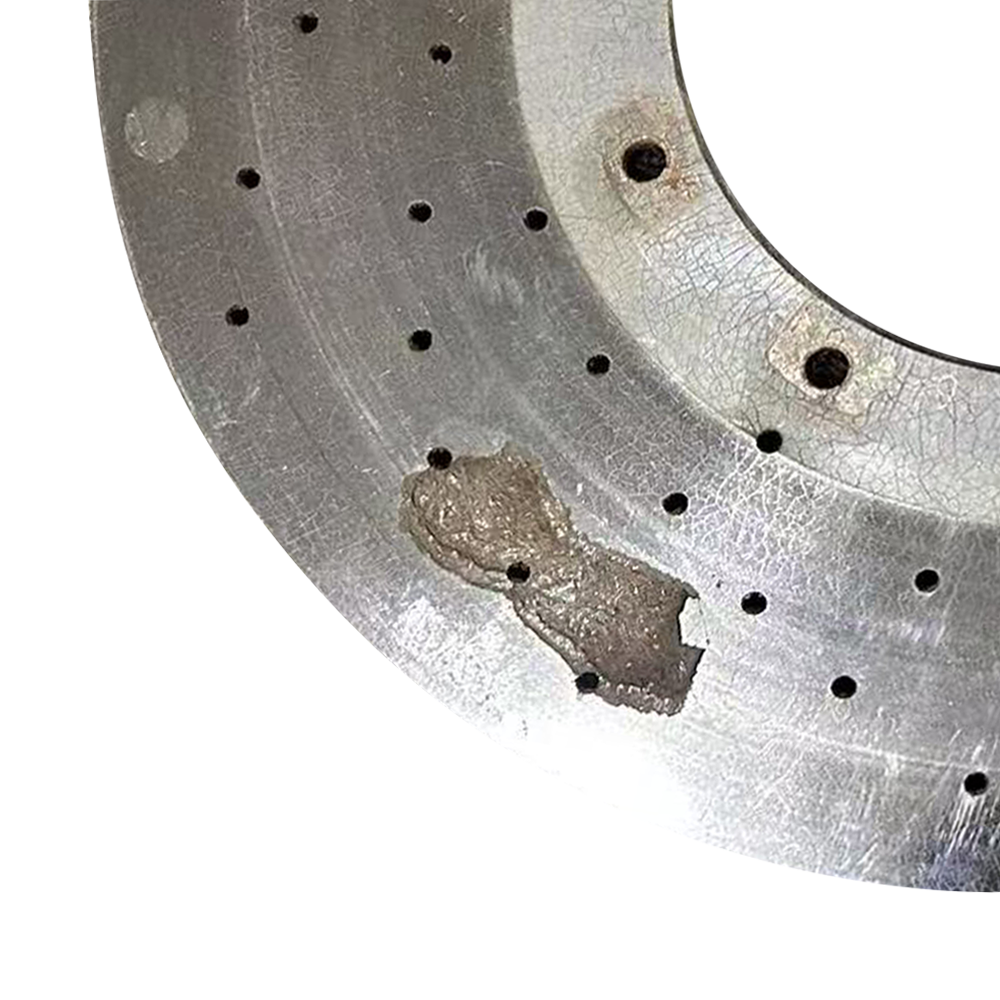 This carbon ceramic disc has gouges on the surface.