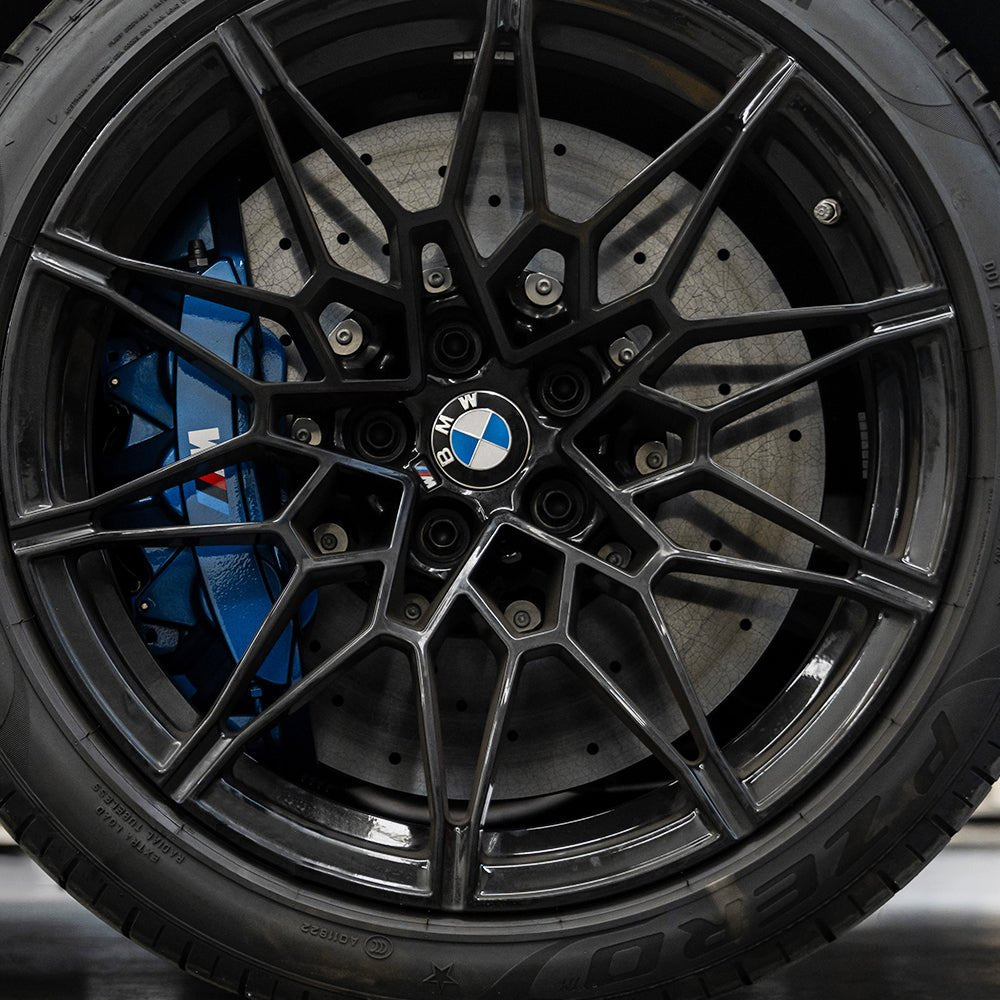 STOPFLEX carbon ceramic rotor installed on BMW M4 front wheel with an OE BMW M Power 6-pot brake caliper.