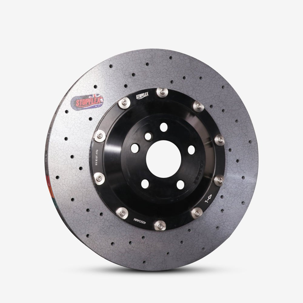 A STOPFLEX aftermarket lightweight two-piece drilled carbon ceramic brake rotor.