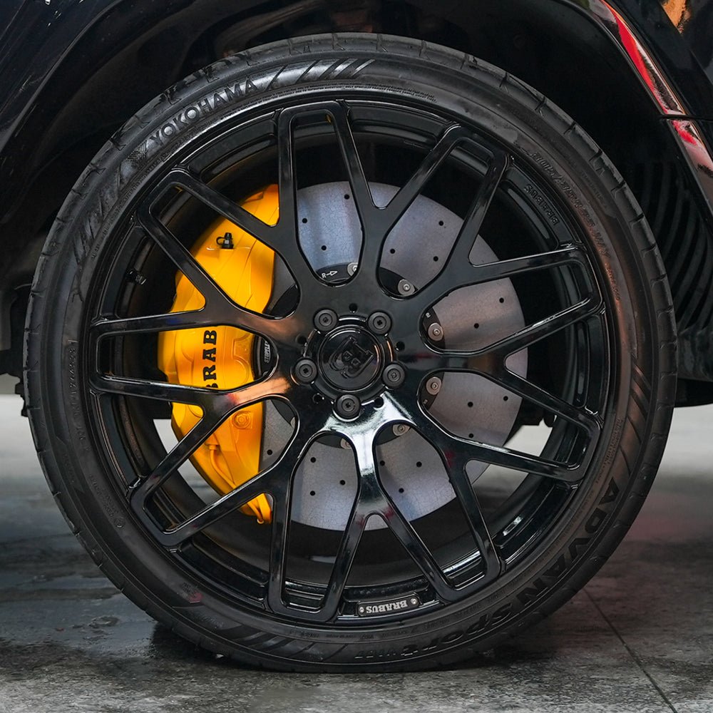 STOPFLEX carbon ceramic rotor installed on Mercedes-AMG G63 front wheel with an Akebono 10-pot brake caliper.