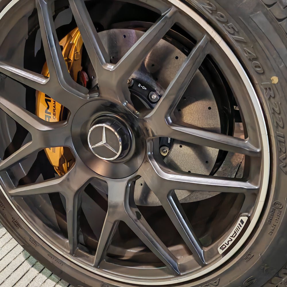 STOPFLEX carbon ceramic rotor installed on ​​Mercedes-AMG G63 front wheel with an OE AMG 8-pot brake caliper.